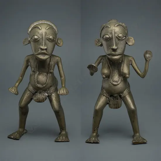 A pair of white metal alloy figures,